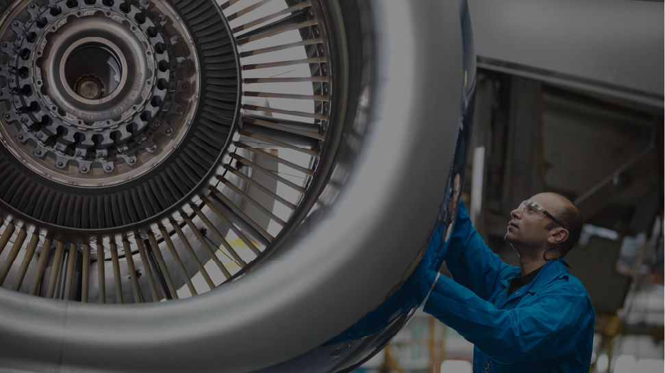 Signature Aviation Professional Working on Engine