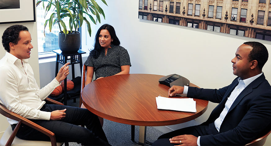 Blackstone Professionals at Office Table